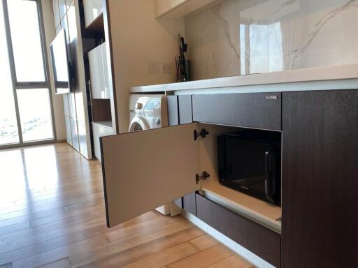 Modern kitchen with built-in microwave and washing machine