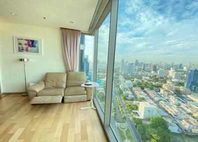 Living room with large windows and city view