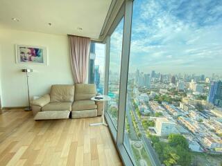 Living room with large windows and city view