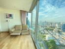 Living room with large windows and city view