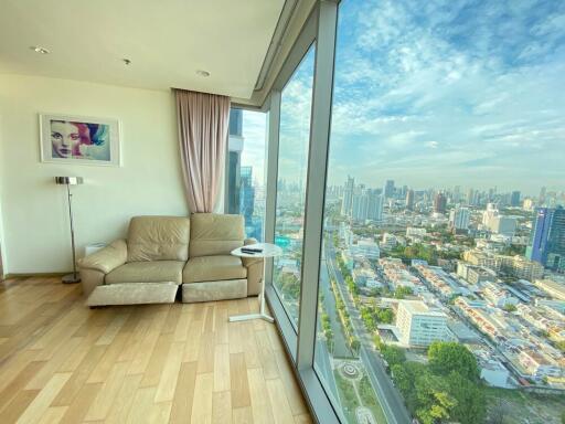 Living room with large windows and city view