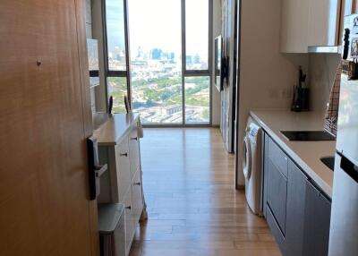 Modern kitchen with wooden flooring and a city view