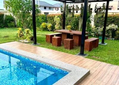 Outdoor area with pool and seating