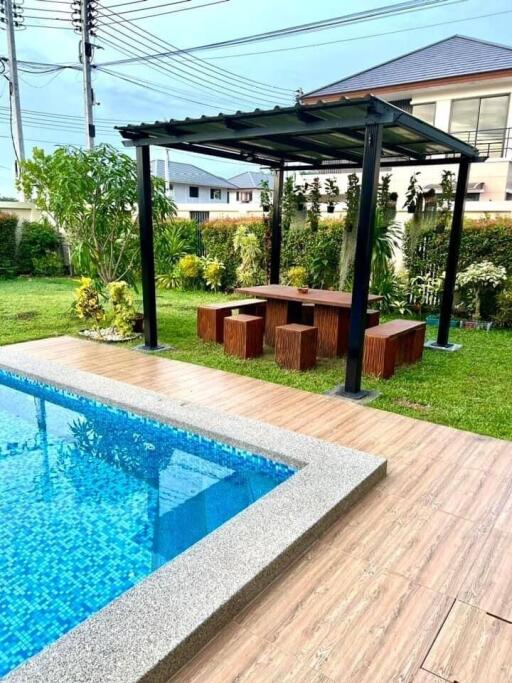 Outdoor area with pool and seating