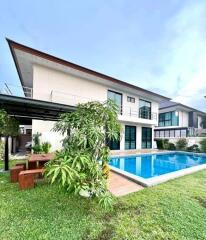 Modern house with swimming pool and garden