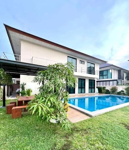 Modern house with swimming pool and garden