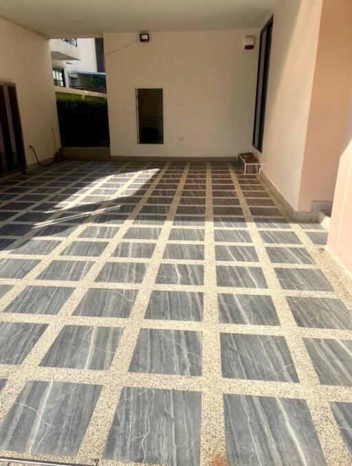 covered outdoor area with tile flooring