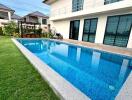 Exterior view of a modern house with a swimming pool