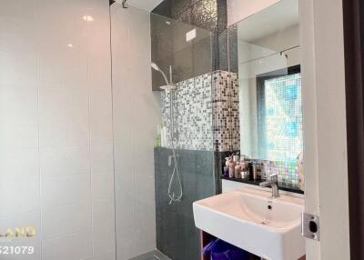 Modern bathroom with glass-enclosed shower