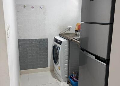 Small kitchen space with washing machine and refrigerator