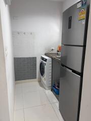 Small kitchen space with washing machine and refrigerator