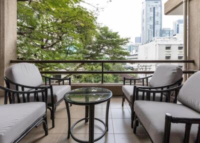 Cozy balcony with seating area and table