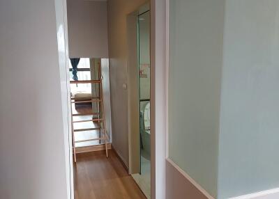 Modern hallway with wooden flooring and glass partition