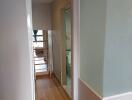 Modern hallway with wooden flooring and glass partition