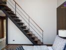 Modern bedroom with a staircase leading to an upper floor