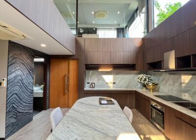 Modern kitchen with island and wooden cabinetry