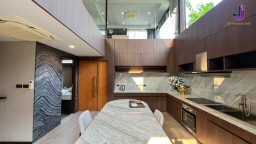 Modern kitchen with island and wooden cabinetry