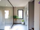 Bright hallway with plants and large window