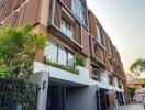 Three-story modern apartment building with balconies