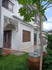 Two-story residential building with a front yard