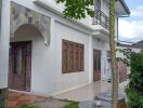 Two-story residential building with a front yard