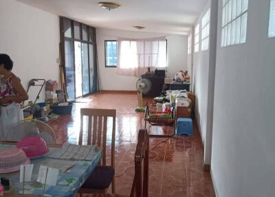 Spacious dining and living area with tiled floor