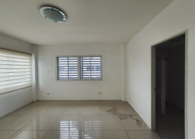 Unfurnished living room with windows and tiled floor