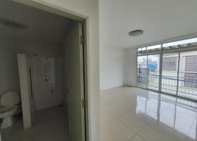 Unfurnished room with balcony and adjacent bathroom