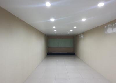 Empty room with recessed lighting and tiled floor