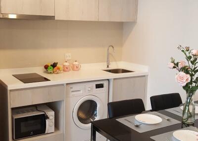 Modern kitchen with appliances and dining table