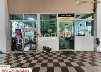 Facade of a minimart with glass doors and windows