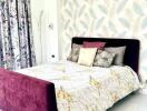 Modern bedroom with a stylish bed, patterned curtains, and wall-mounted air conditioner