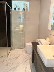 Modern bathroom with glass shower and large vanity