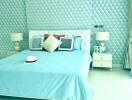 Well-lit bedroom with turquoise theme and stylish decor