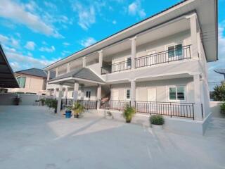 Two-story building with balconies and outdoor space