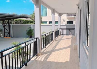 Spacious balcony with railings and tiled floor