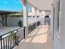 Spacious balcony with railings and tiled floor