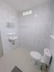 Bathroom with tiling and fixtures