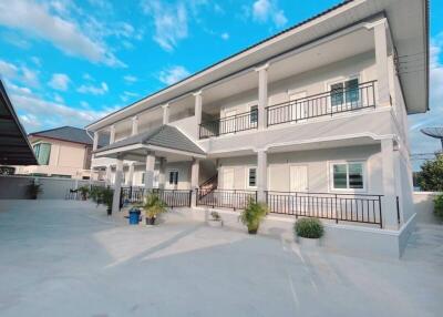 Exterior view of a two-story residential building with balconies