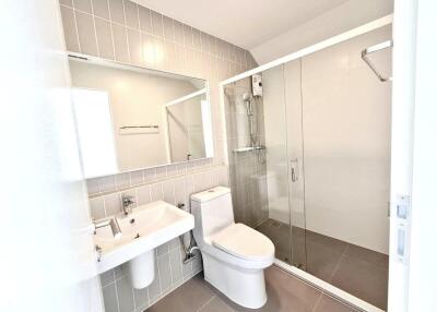 Modern bathroom with glass-enclosed shower