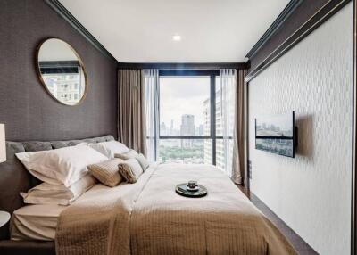 Modern bedroom with large window and city view