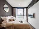 Modern bedroom with large window and city view