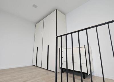 Minimalist bedroom with wardrobe and chest of drawers