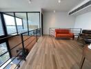 Modern living room with hardwood flooring and city view