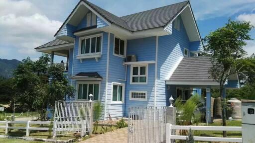 Exterior view of a modern blue house