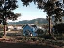 Scenic view of houses in a rural area with mountains in the background