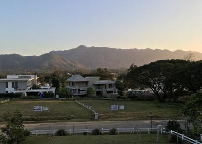 Scenic view of houses with mountains in the background