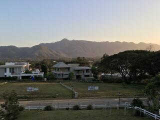 Scenic view of houses with mountains in the background