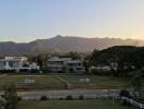 Scenic view of houses with mountains in the background