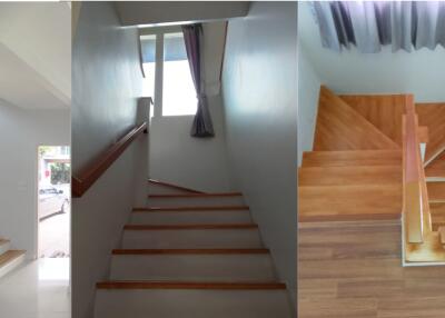 Staircase with wooden steps and white walls